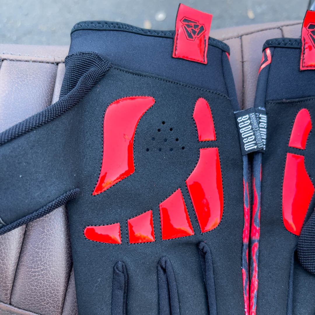 Red motorcycle glove with padded palms.