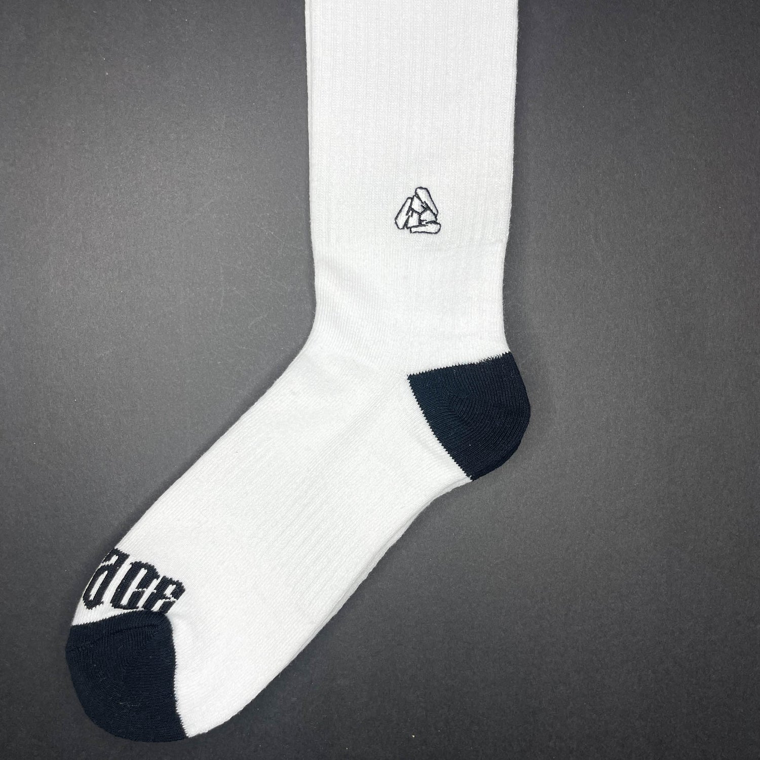 Side view of Menace Clothing Hood Rat black and white knee high socks with Menace on toes and Tri M logo on side.