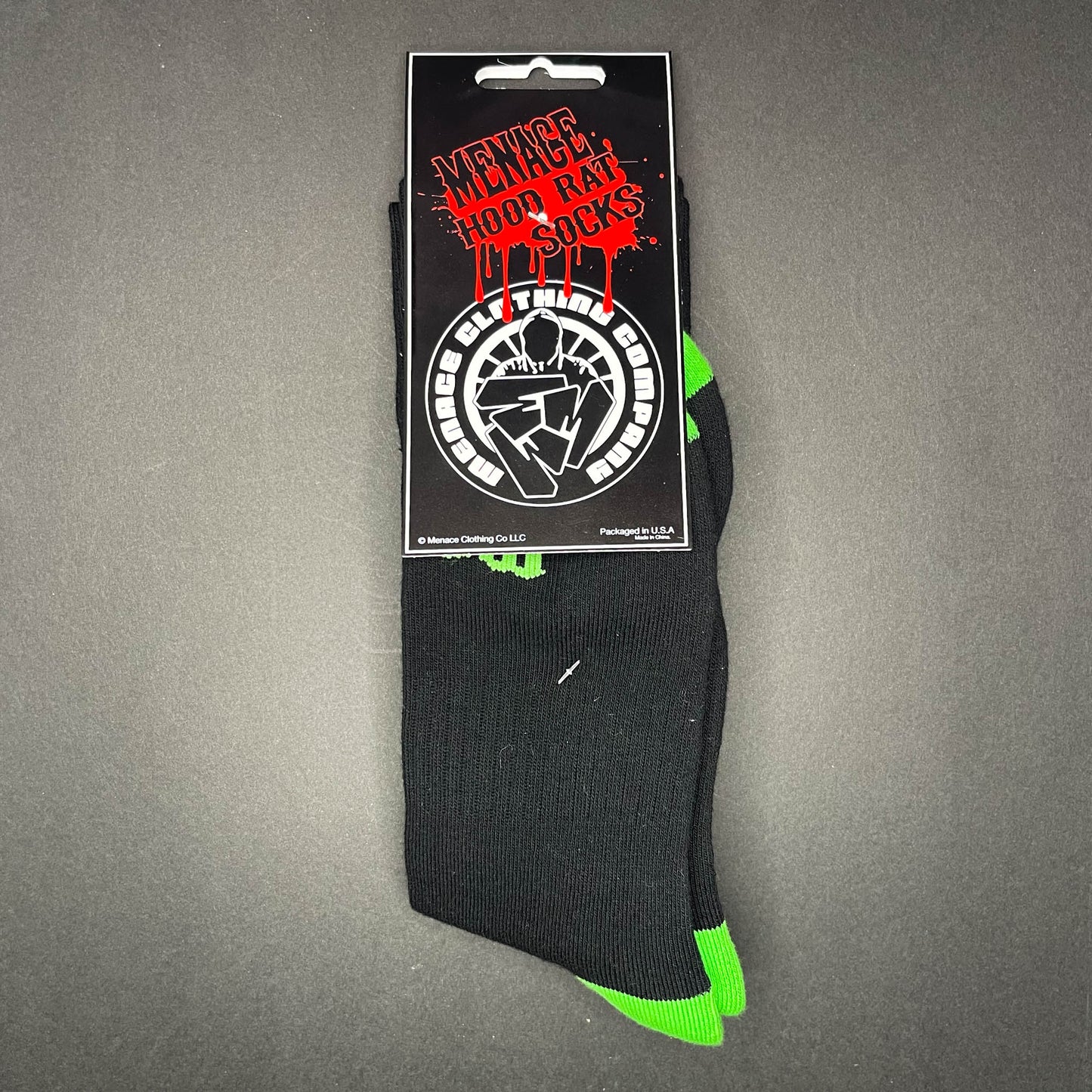 Menace Clothing green and black Hood Rat knee high socks with packaging.
