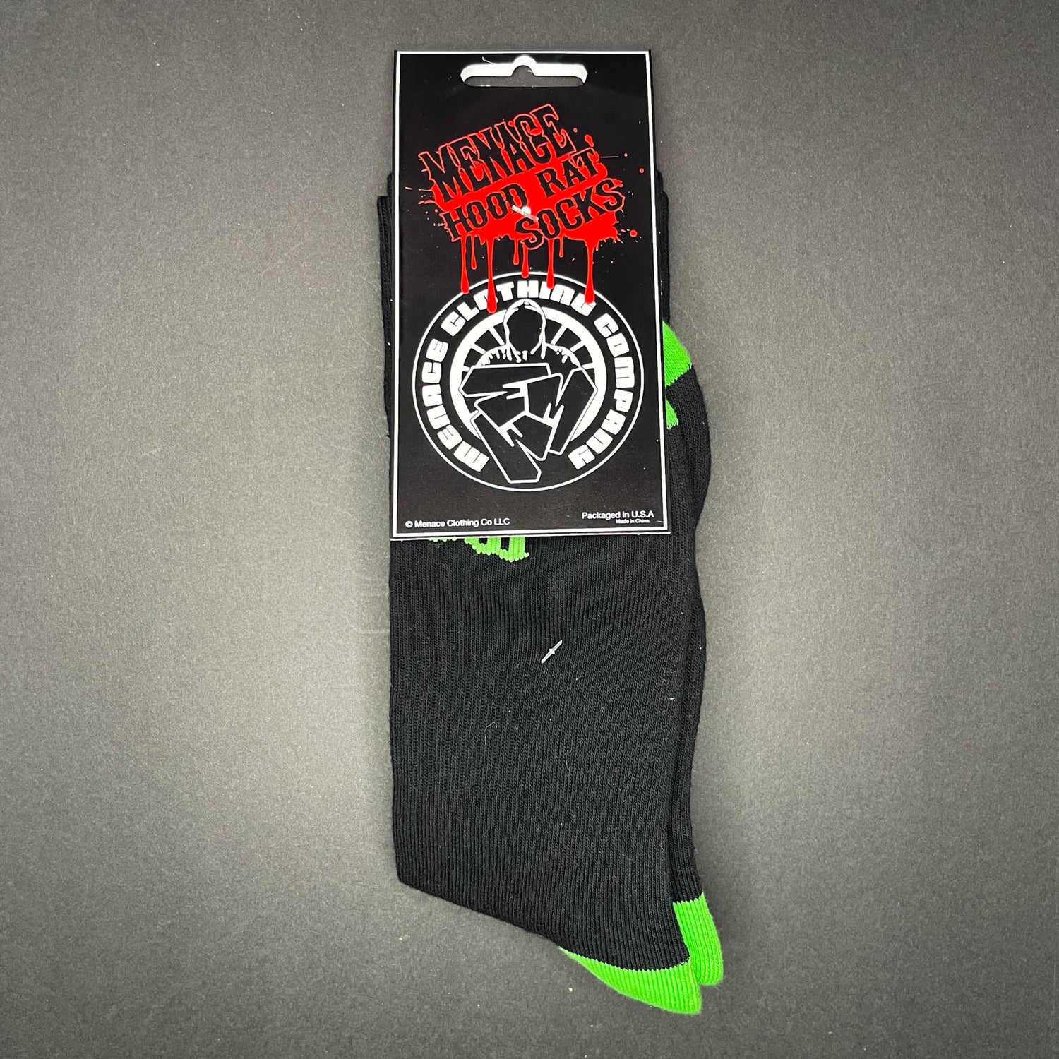 Menace Clothing green and black Hood Rat knee high socks with packaging.