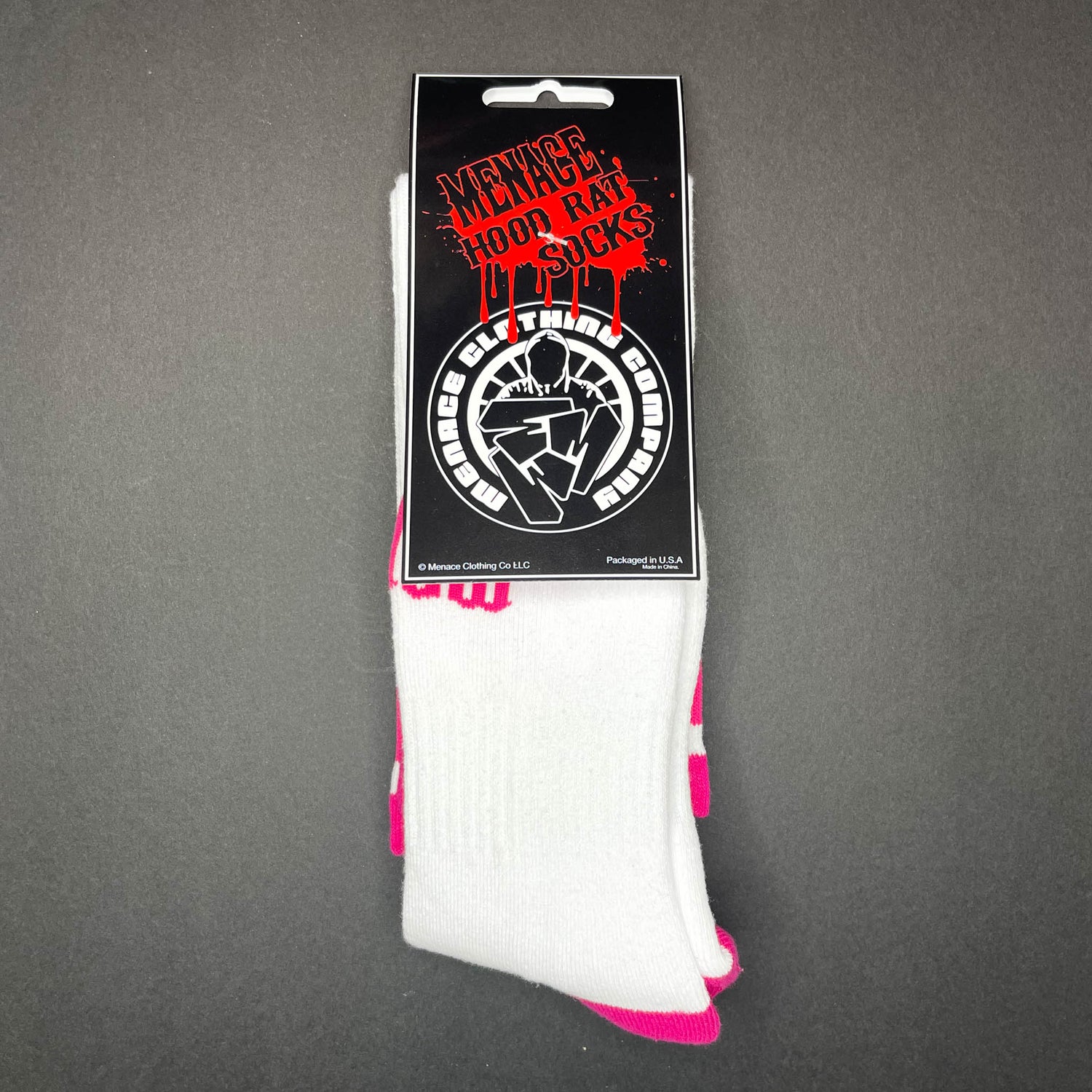 Menace Clothing pink and white Hood Rat knee high socks with packaging.