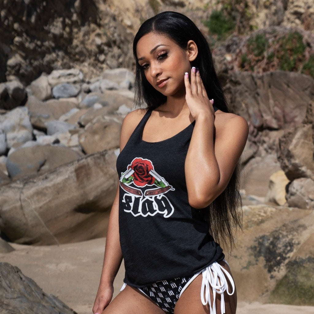 Female wearing black Menace Clothing Slay tank top.