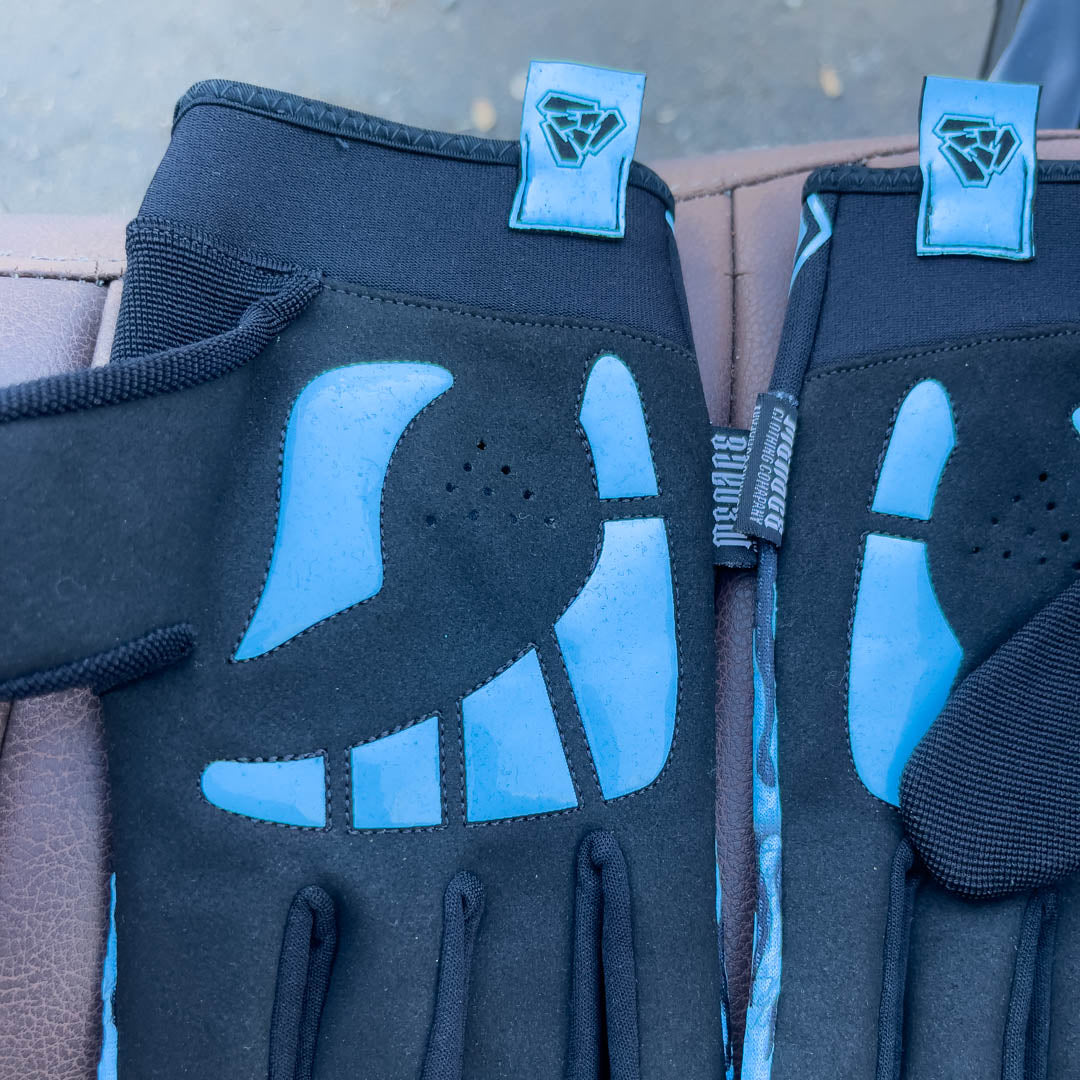 Blue motorcycle glove with padded palms.