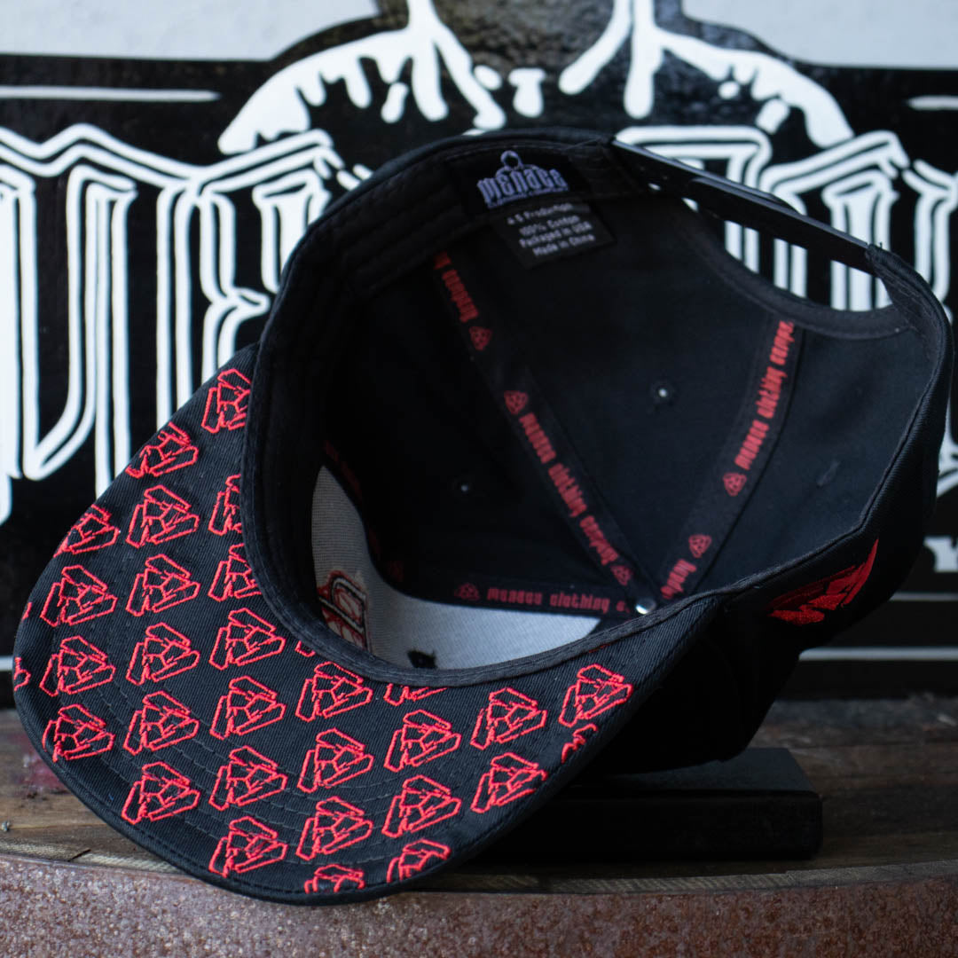 Embroidered brim of Menace Clothing black and red baseball hat with Menace Tri M logo. 