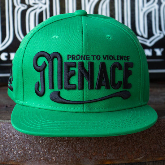 Front of Menace Clothing green baseball hat with black puff embroidered saying Menace Prone To Violence. 
