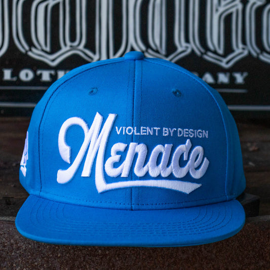 Front of Menace Clothing blue baseball hat with white puff embroidered saying Menace Violent By Design.